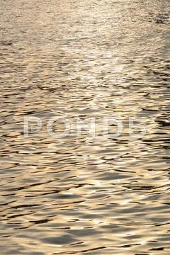 Sunlight reflecting on water Stock Photos