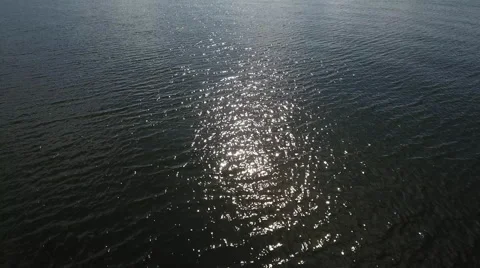 Sunlight reflecting off the water's surface Stock Footage 66387358