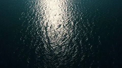 Sunlight Reflecting Off Waves Fly Over Stock Footage 71506934