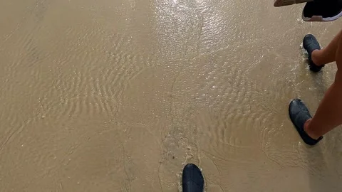 Sunlight Reflecting on Wet Beach Sand Stock Footage 301646552