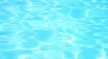 Sunlight Reflection in Blue Turquoise Water. Swimming Pool in Luxury Resort. HD Footage