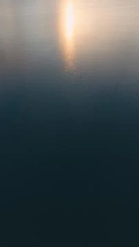 Sunlight Reflection on Dark Ocean Water 스톡 사진