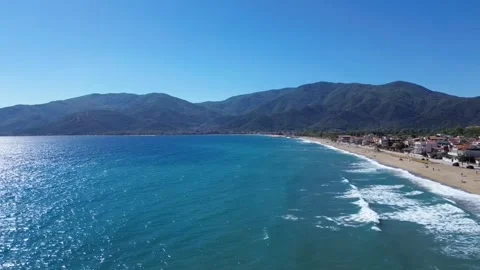 Sunlight Reflection on Ocean Surface with Distant Coast Aerial Video stock 332981892