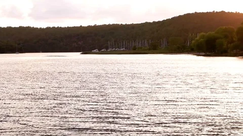 Sunlight Reflection in Water with port in background Skradin port during sunset Video stock 87959901