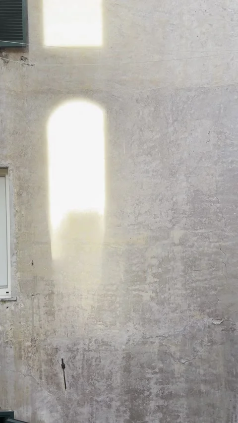 Sunlight Reflection on Weathered Beige Wall Texture Vertical Background Stock Footage 340453756