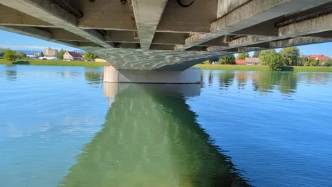 Sunlight reflections dancing on the concrete bottom surface of a bridge ove.. Vídeos de archivo 341678367