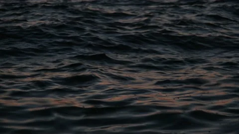 Sunlight Reflections On The Rippling Ocean Water During Sunset close up Video stock 135270025