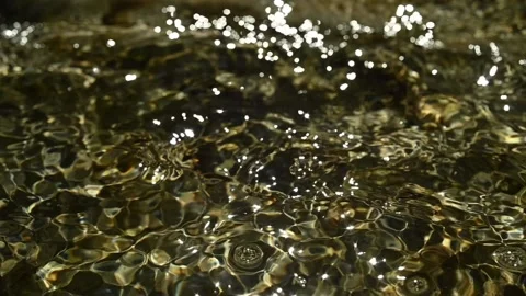 Sunlight reflections of the water in a mountain riverbed (slow motion) Stock-Footage 211746189