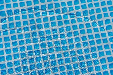 Sunlight reflects off the surface of the pool. Stock Photos