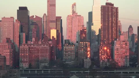 Sunlight reflects off windows of numerous skyscrapers and residential build.. Video stock 334781469