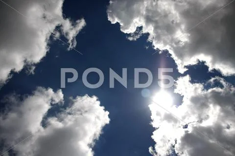 Sunlight reflex on clouds Stock Photos