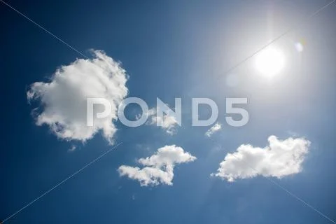 Sunlight reflex on clouds Stock Photos