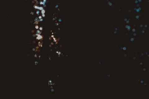 Sunlight running through tree leaves and flaring in Pamplona, Spain Stock Photos