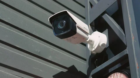 At sunlight security camera moving recording on building outdoors. CCTV Stock Footage 151440011