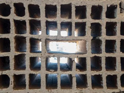 Sunlight is seeping in inside of rectangle bricks Stock Photos