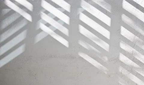 Sunlight shade on white wall Stock Photos