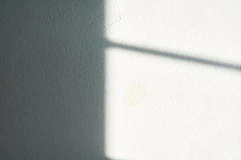Sunlight shadow pattern on a wall used for texture pattern bright sun Stock Photos