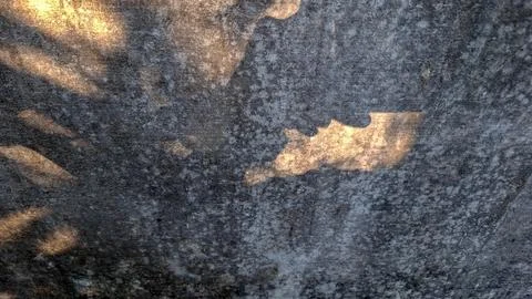 Sunlight Shadow Patterns on Textured Concrete Wall Stock Photos