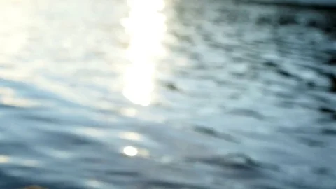 Sunlight shimmering in moving water, out of focus, abstract Stock Footage 83252097