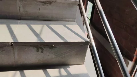 Sunlight shines on grey stairs Stock Footage 321084997