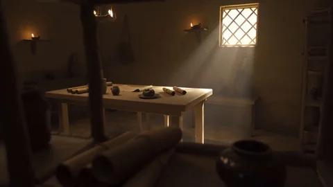 Sunlight shines in old study from window, ancient scroll and paper, panning lens Stock Footage 128946201