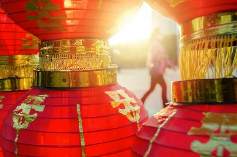 Sunlight shines through red Chinese lantern. Stock Photos