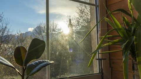 Sunlight shines in through the window of a beautiful. Silhouette of church an Stock Photos