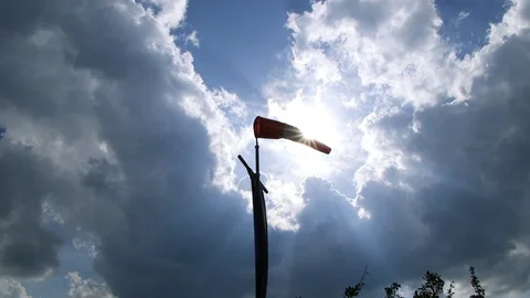 Sunlight shining behind a windsock Video stock 93830560