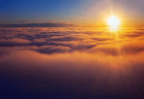 Sunlight Shining Over The Clouds Stock Photos