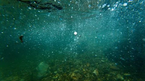 Sunlight shining ,the surface and under the blue ocean, sea wave , with cle.. Stock Photos