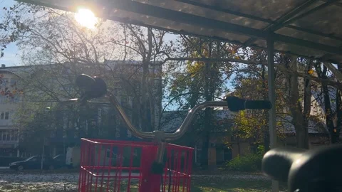 Sunlight shining through bicycle parking roof with lens flare in Novi Sad Stock Footage 346483359