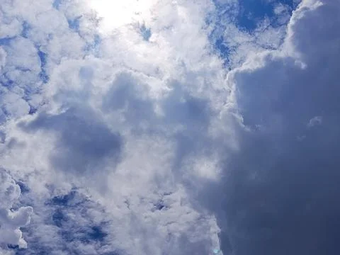 Sunlight shining through dense clouds creates a dramatic sky 库存照片