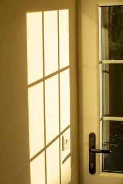 Sunlight shining through a door window. Stock Photos