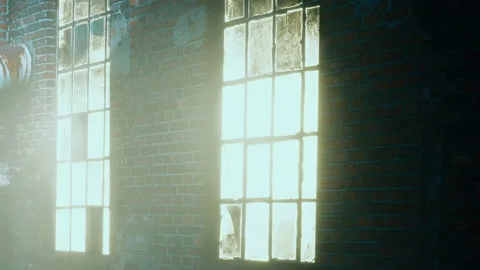 Sunlight shining through large windows in an old brick building Stock Footage 340993344
