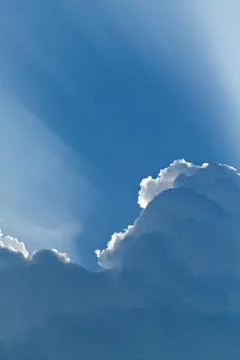 Sunlight shining through layers of clouds Stock Photos