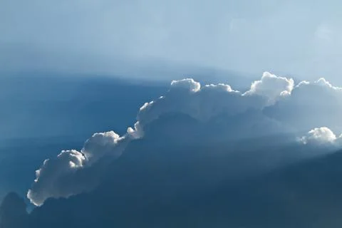 Sunlight shining through layers of clouds Stock Photos