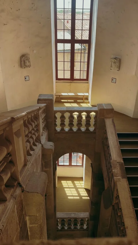Sunlight shining through tall windows inside a historic staircase hall. Stock Footage 336724302