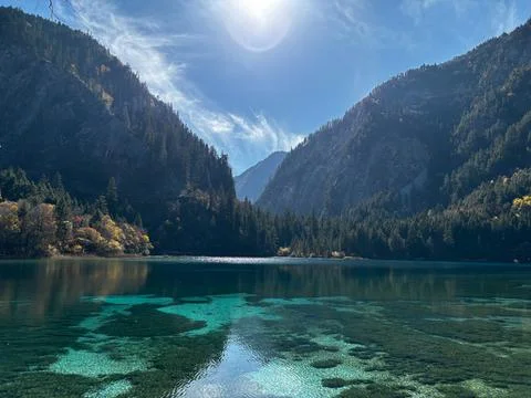 Sunlight Shining On Vibrant Five Flower Lake In Jiuzhaigou National Park Stock Photos