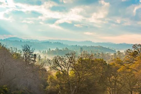 Sunlight Shinning Through the Clouds Stock Photos