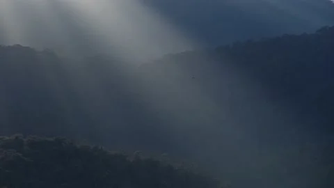 Sunlight sine pass through mountain Stock Footage 233361352