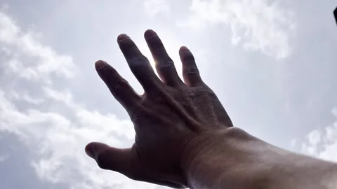 Sunlight slips between your fingers Stock Footage 329744506