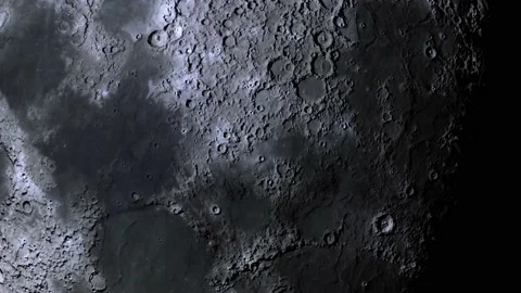 Sunlight slowly illuminates the surface of the moon and fades away. Stock Footage 234770571