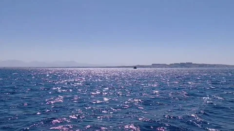 Sunlight sparkling on deep blue Red Sea water near Hurghada shore in Egypt. Stock Footage 341361978