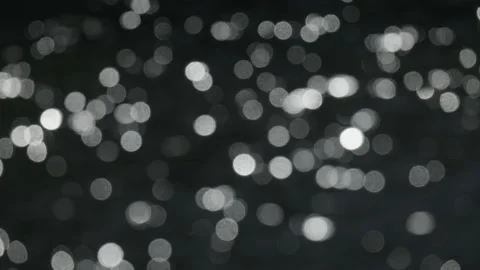 Sunlight sparkling on a lake out of focus creates an abstract random pattern. 4K Stock Footage 177283512