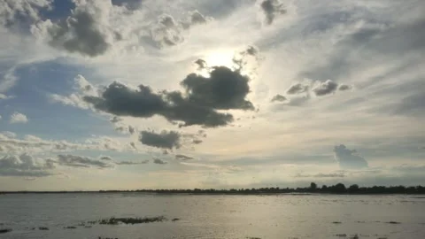 Sunlight Sparkling On Lake Water Surface With Sun Behind Clouds Stock Footage 341429207