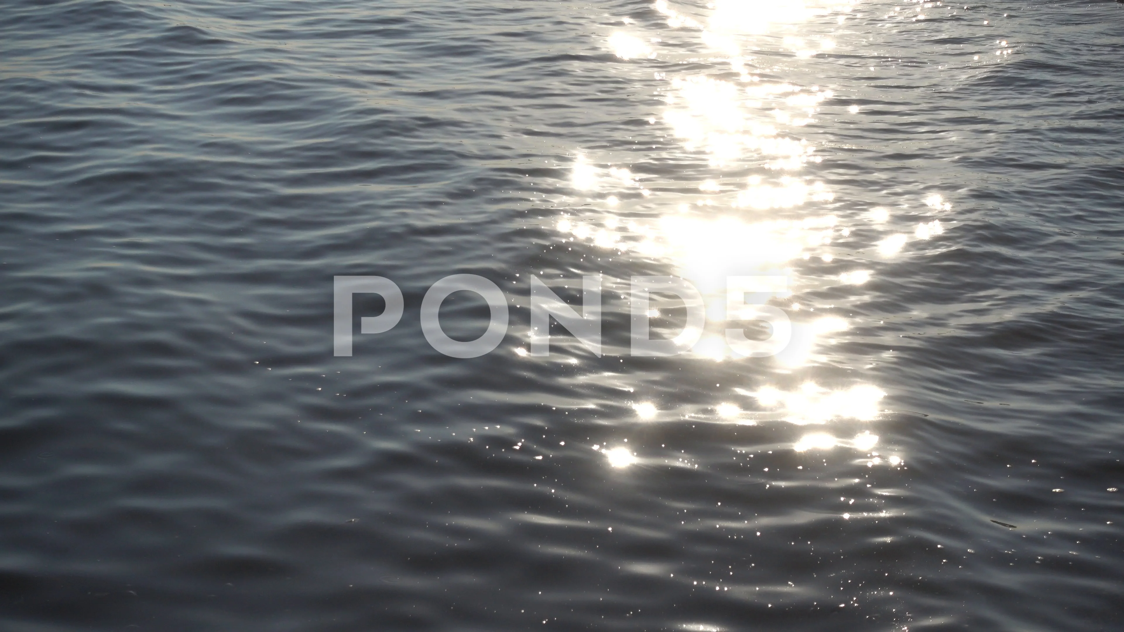 Sunlight Sparkling On Ocean Water At Sunset Video