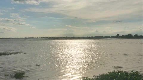 Sunlight Sparkling On Water Surface Of Lake Landscape In Rural Cambodia Stock Footage 341685270