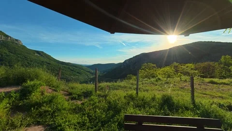 Sunlight spills through an open umbrella frame. Sicevo Gorge, Serbia. Stock Footage 337052364