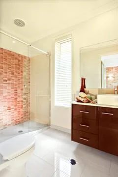 Sunlight spreading inside of a modern bathroom wall and the floor Stock Photos