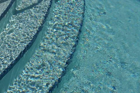 Sunlight on the steps of a swimming pool. Foto stock